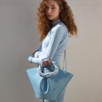 Minimal Twisted Handle Bucket Tote des femmes