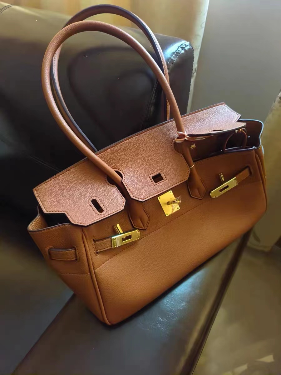 Women's Genuine Leather Top Handle Bag with Lock Closure photo review