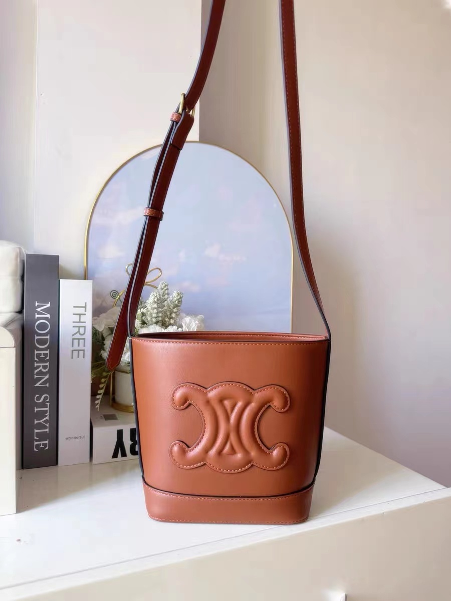 Women's Genuine Leather Triumph Arch Crossbody Bucket Bag photo review