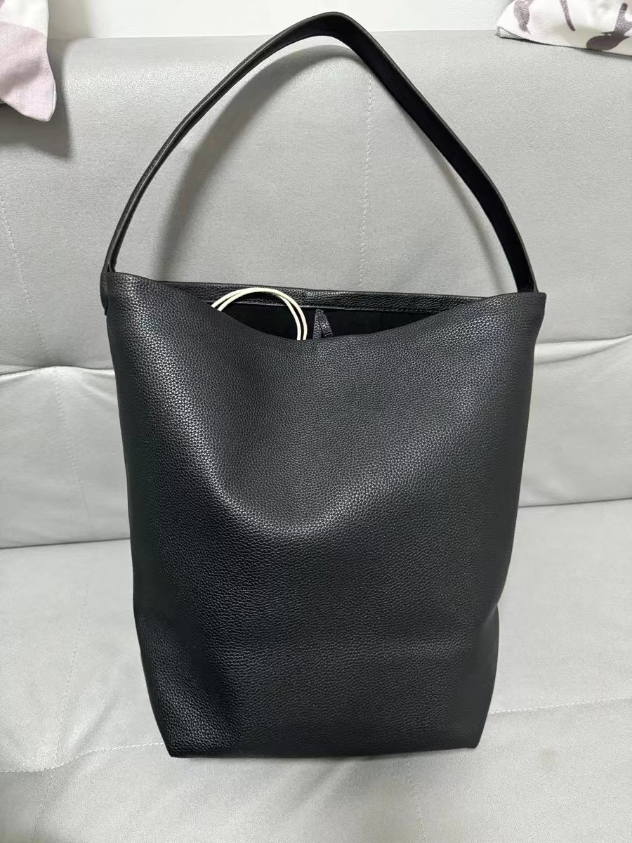 Women's Minimalist Genuine Leather Shoulder Bucket Bag with Drawstring photo review
