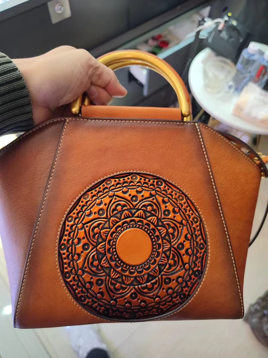 Women's Totem Embossed Vintage Top Handle Handbags in Genuine Leather photo review