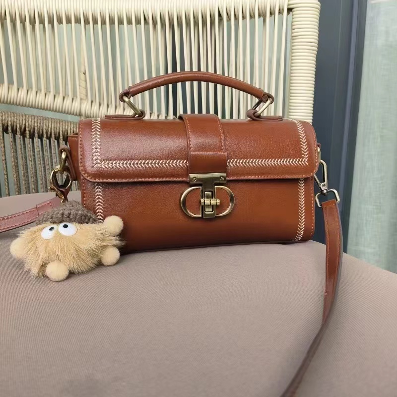 Women's Vintage Genuine Leather Crossbody Top Handle Bag with Lock Closure photo review