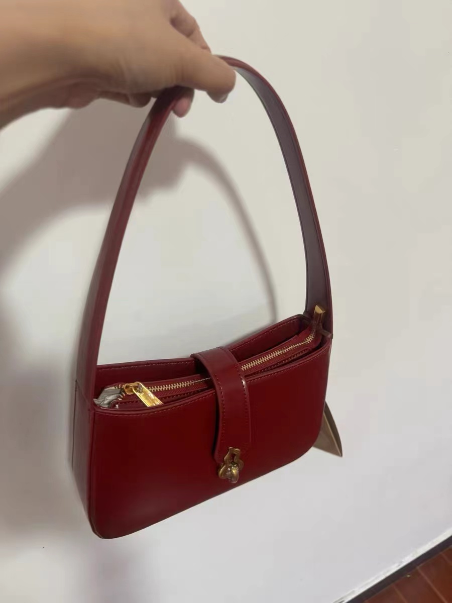 Women's Minimalist Genuine Leather Gourd Shape Buckle Baguette Bag photo review