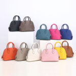 Sac à main en cuir véritable à fermeture éclair en forme de coquillage pour femmes