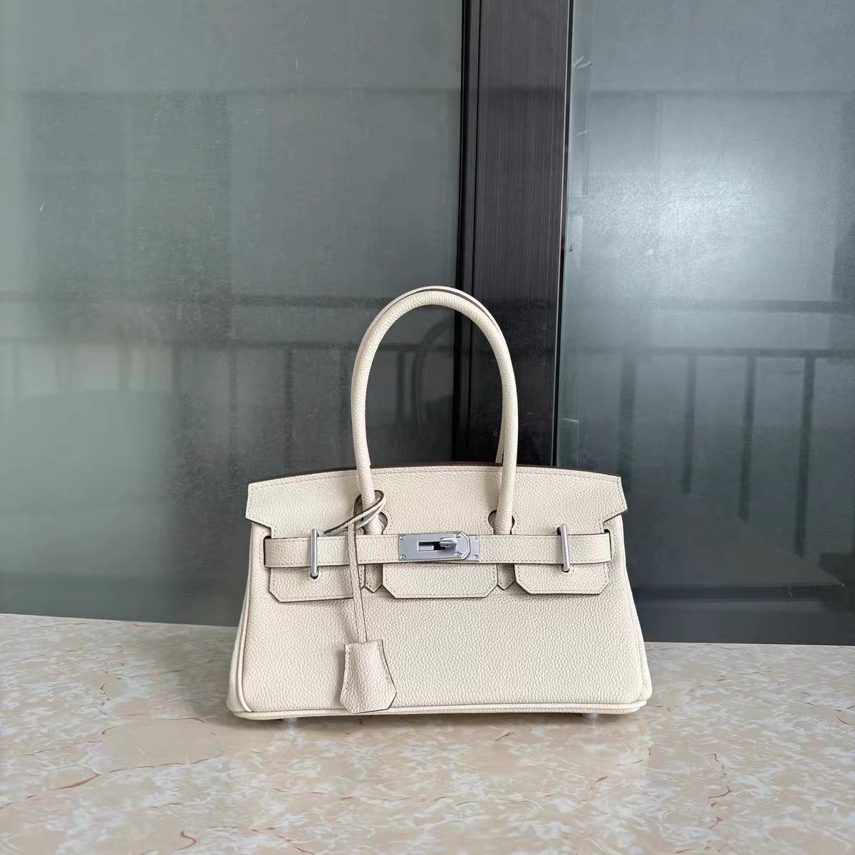 Women's Genuine Leather Top Handle Bag with Lock Closure photo review