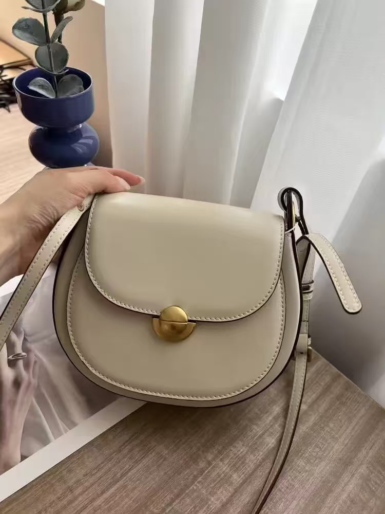 Women's Minimalist Genuine Leather Lock Buckle Crossbody Saddle Bag photo review