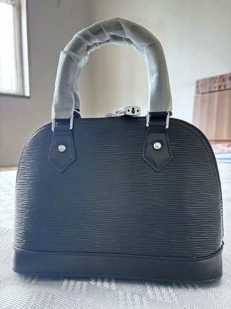 Sac à main en cuir véritable avec boucle de verrouillage en forme de coquillage pour femmes photo review