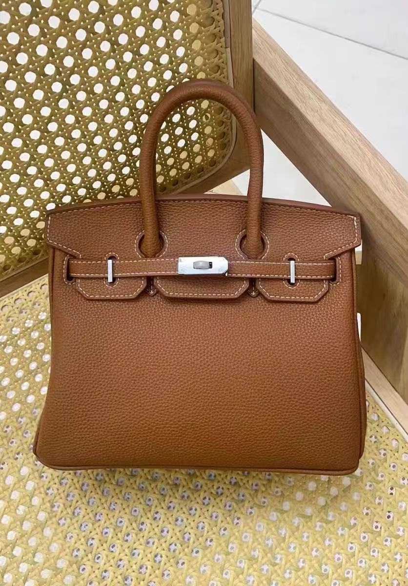 Women's Full-Grain Leather Top Handle Bag In Silver Lock Closure photo review