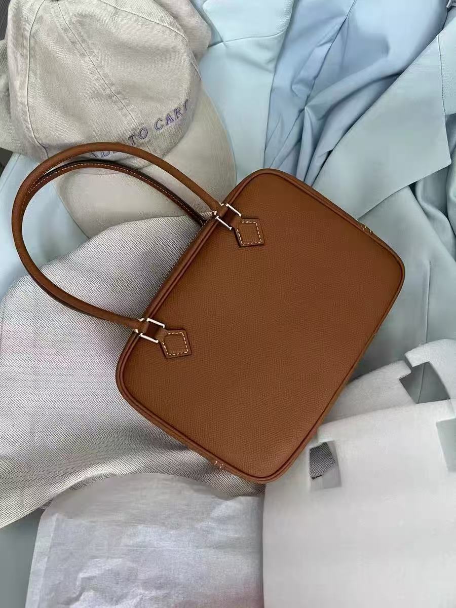 Minimalistische Damen-Reißverschlusstasche aus echtem Leder mit oberem Griff photo review