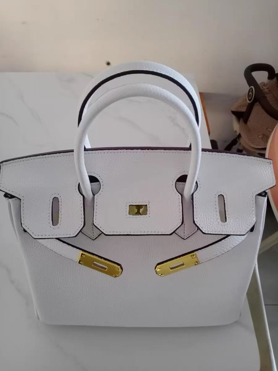 Women's Vintage Full-Grain Leather Top Handle Bag In Gold Lock Closure photo review
