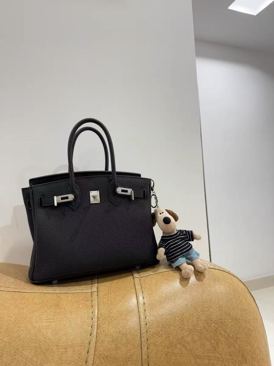 Women's Full-Grain Leather Top Handle Bag In Silver Lock Closure photo review