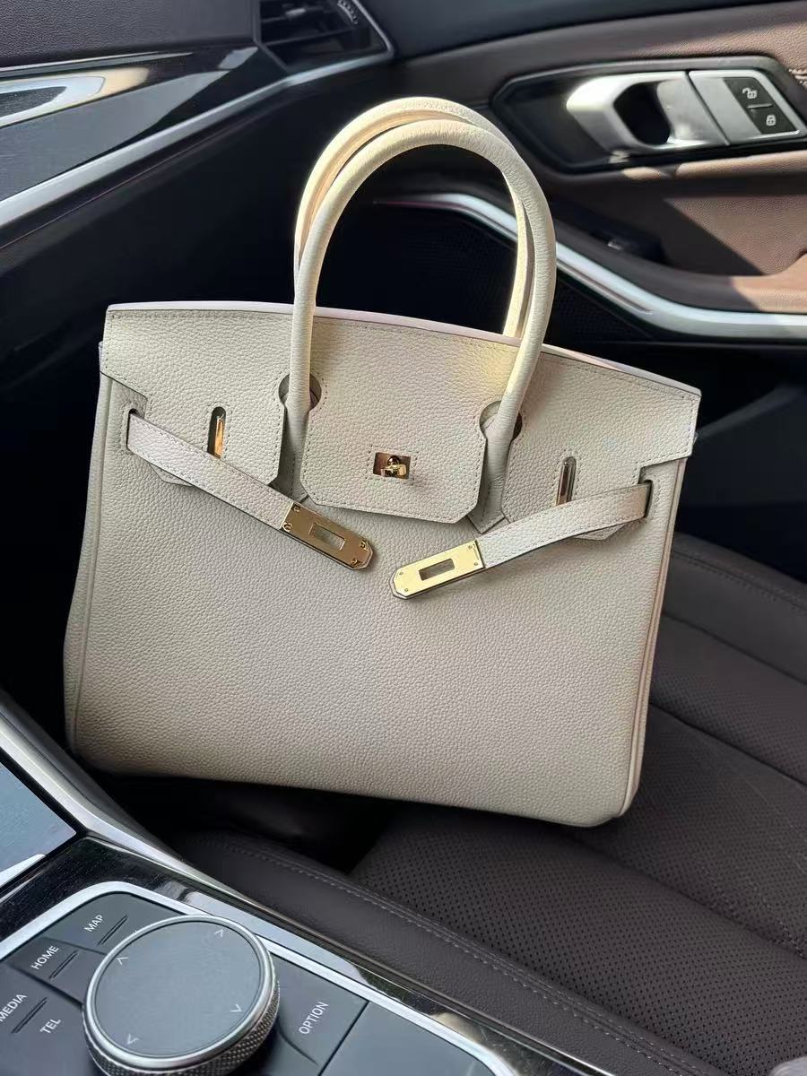Women's Vintage Full-Grain Leather Top Handle Bag In Gold Lock Closure photo review