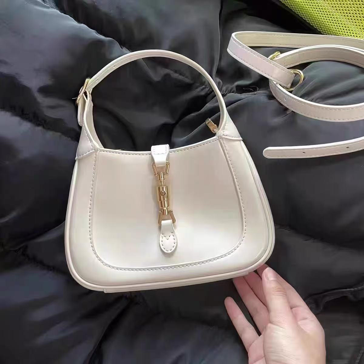 Women's Vintage Genuine Leather Lock Buckle Saddle Shoulder Crossbody Handbag photo review