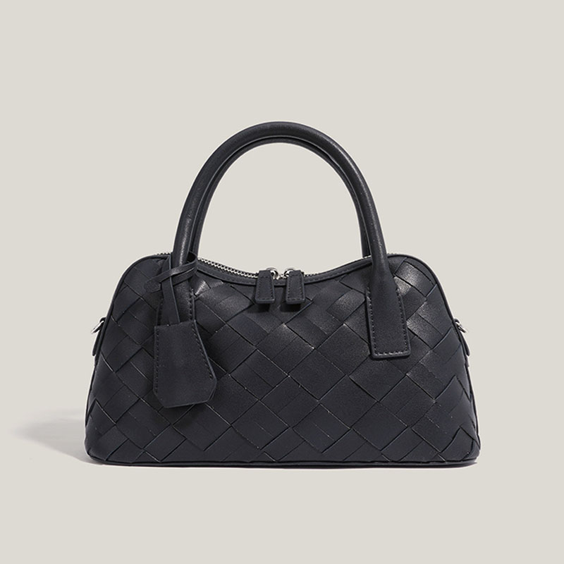 Minimalistische Damen Bowling Handtasche aus gewobenem Spaltleder