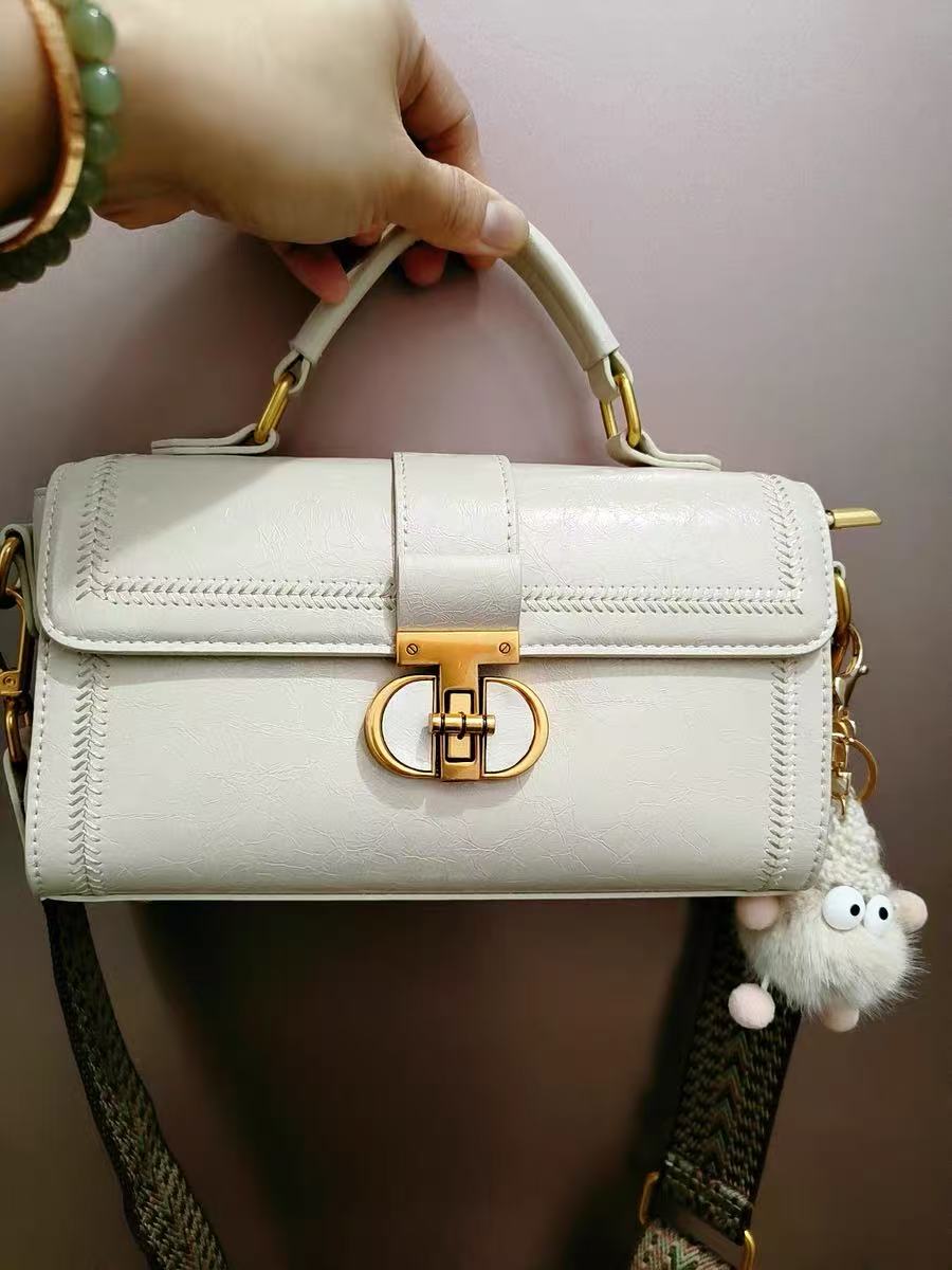 Women's Vintage Genuine Leather Crossbody Top Handle Bag with Lock Closure photo review