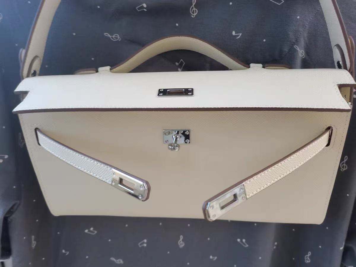 Women's Genuine Leather Top Handle Lock Closure Clutch Bag photo review