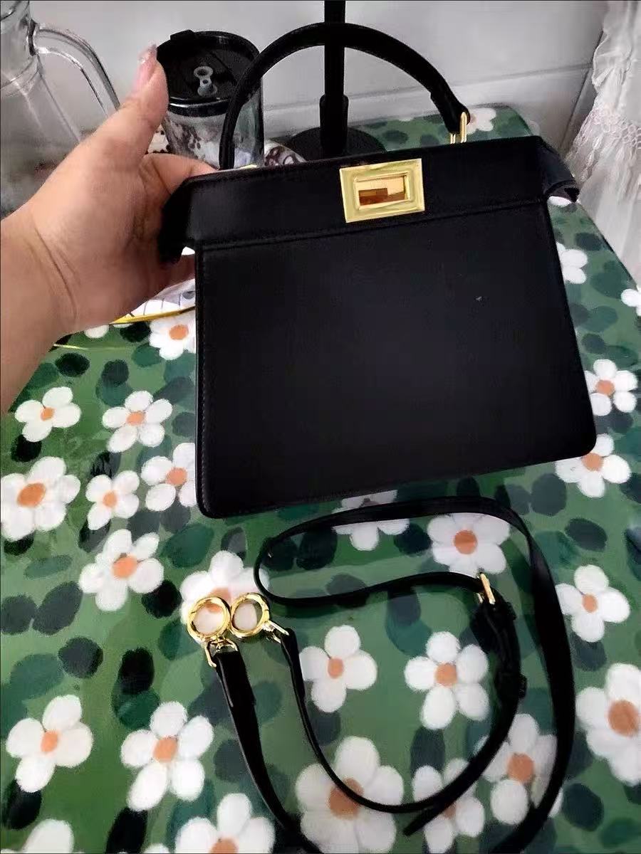 Women's Minimalist Top-Grain Leather Rotating Lock Clasp Handbag In Gold Hardware photo review