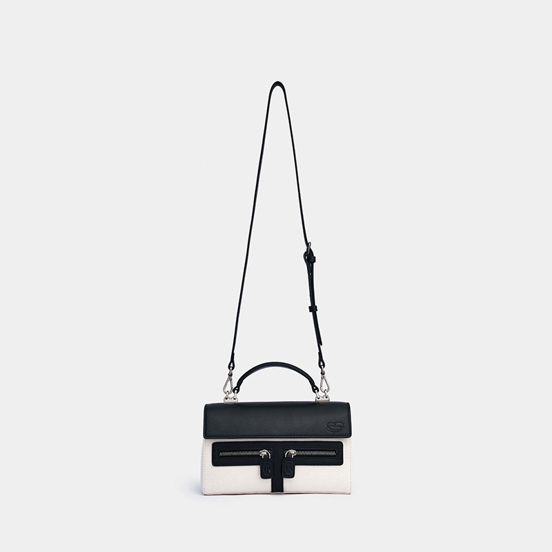 Sac à main en cuir noir avec bandoulière en toile blanche pour femmes