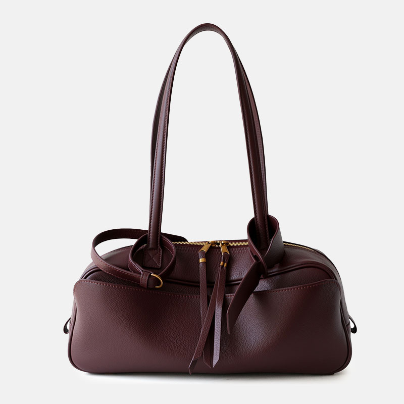 Sac à bandoulière minimaliste en cuir pleine fleur en forme de coussin pour femmes avec fermeture à glissière