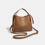 Minimalistische Eimerhandtasche aus echtem Leder mit Umhängeriemen für Frauen