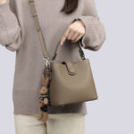Women's Minimalist Full-Grain Leather Crossbody Shoulder Strap Bucket Handbag With Buckle Closure