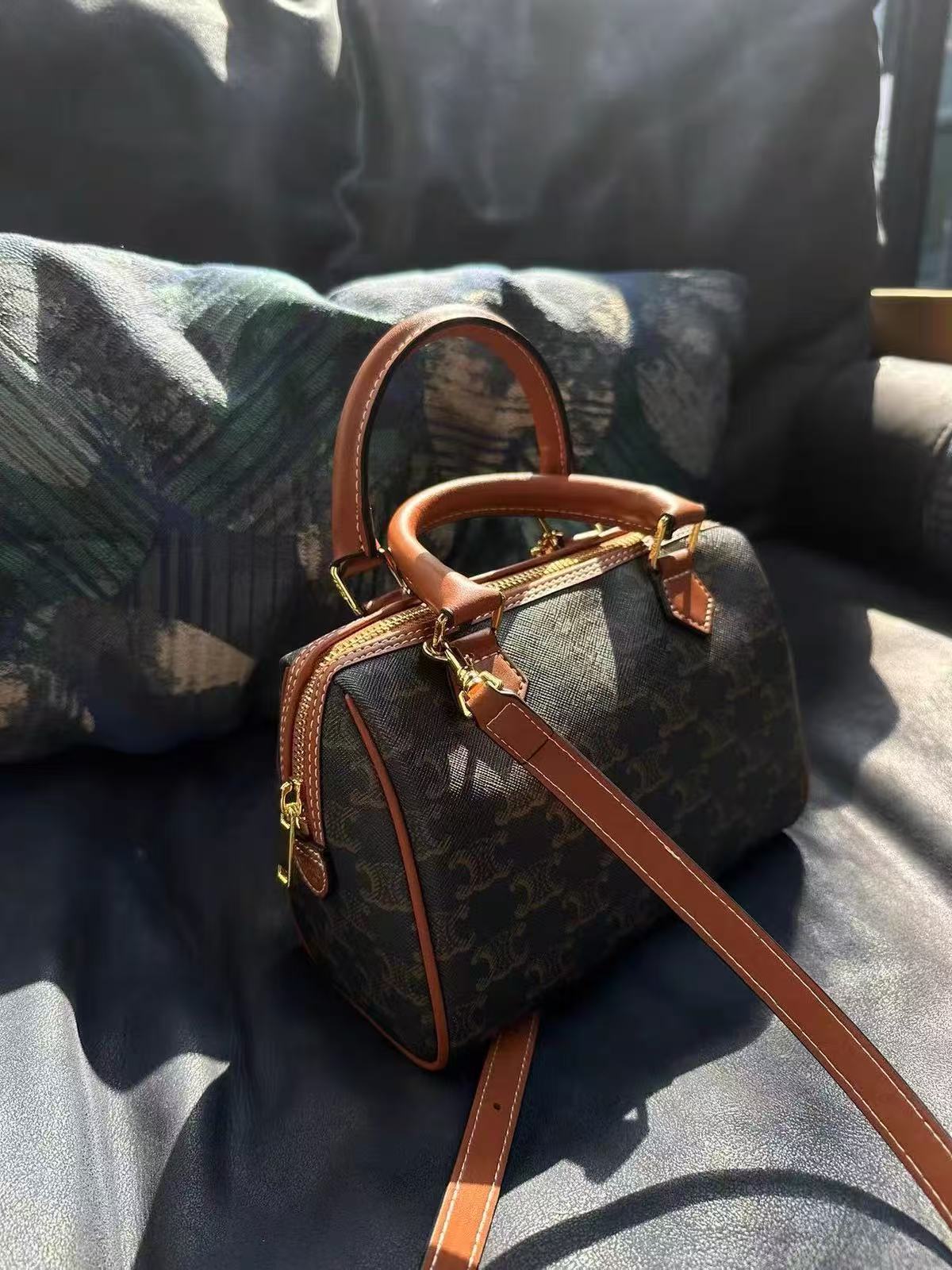Women's Black Printed Leather Zip Boston Top Handle Bag With Crossbody Strap photo review