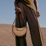 Women's Brown Woven Straw Zipper Closure Crescent Saddle Shoulder Bag with Leather Trim