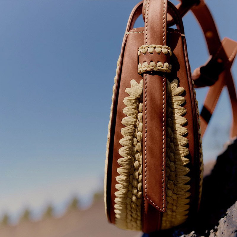 Women's Brown Woven Straw Zipper Closure Crescent Saddle Shoulder Bag with Leather Trim