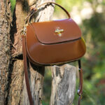 Women's Split Leather Minimalist Oval Flap Lock Crossbody Shoulder Saddle Handbag