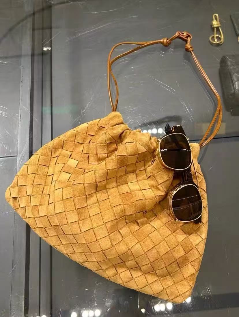 Women's Minimalist Suede Woven Drawstring Crossbody Shoulder Bucket Bag photo review