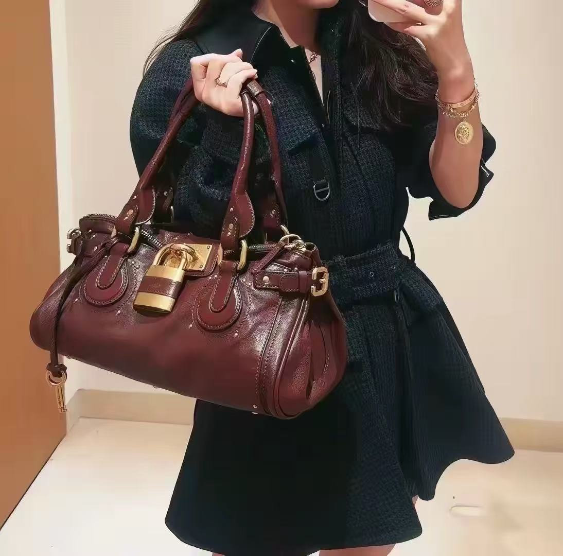 Women's Vegan Leather Studs Boston Handbag with Large Lock photo review