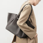 Women's Full-Grain Leather Drawstring Buckle Wing-Shaped Large Shoulder Tote Bag