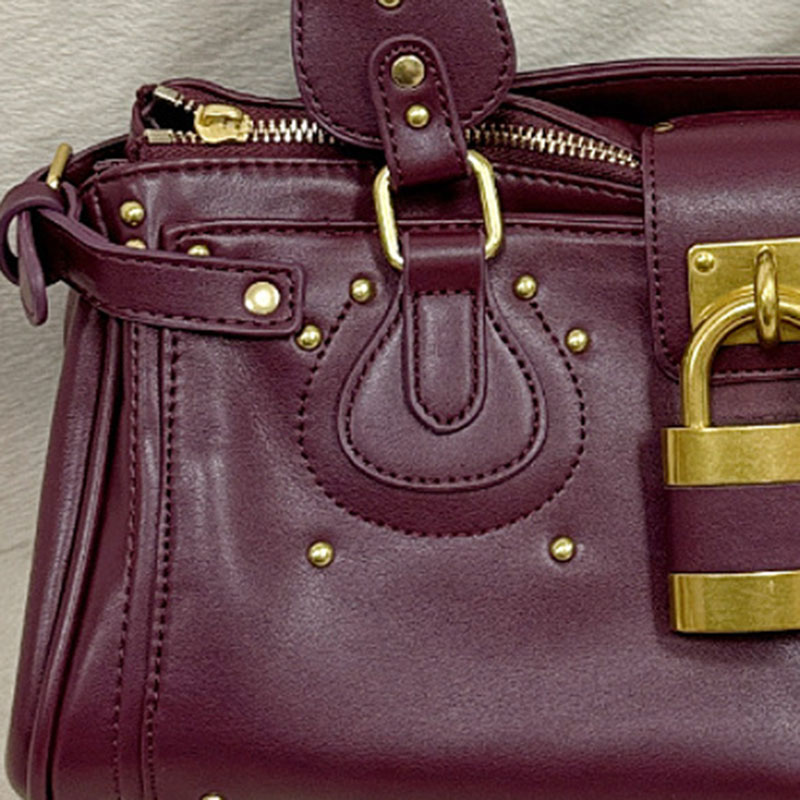 Women's Vegan Leather Studs Boston Handbag with Large Lock