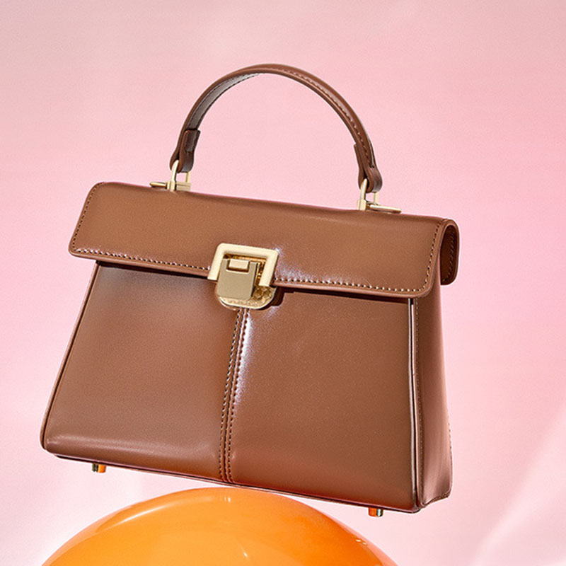 Sac à main en cuir fendu avec fermeture en mors de cheval et bandoulière pour femmes