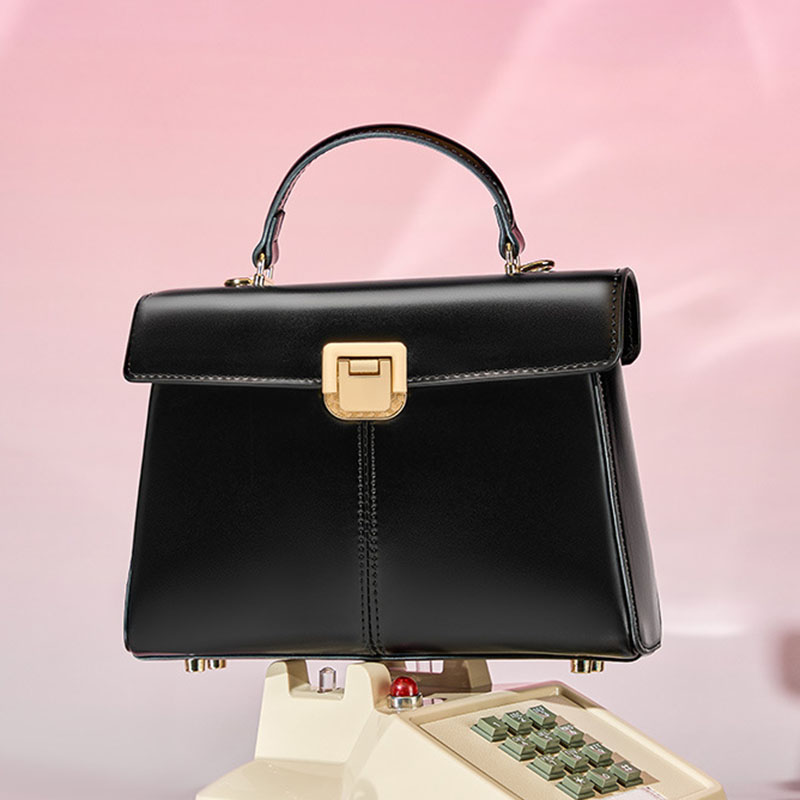 Sac à main en cuir fendu avec fermeture en mors de cheval et bandoulière pour femmes