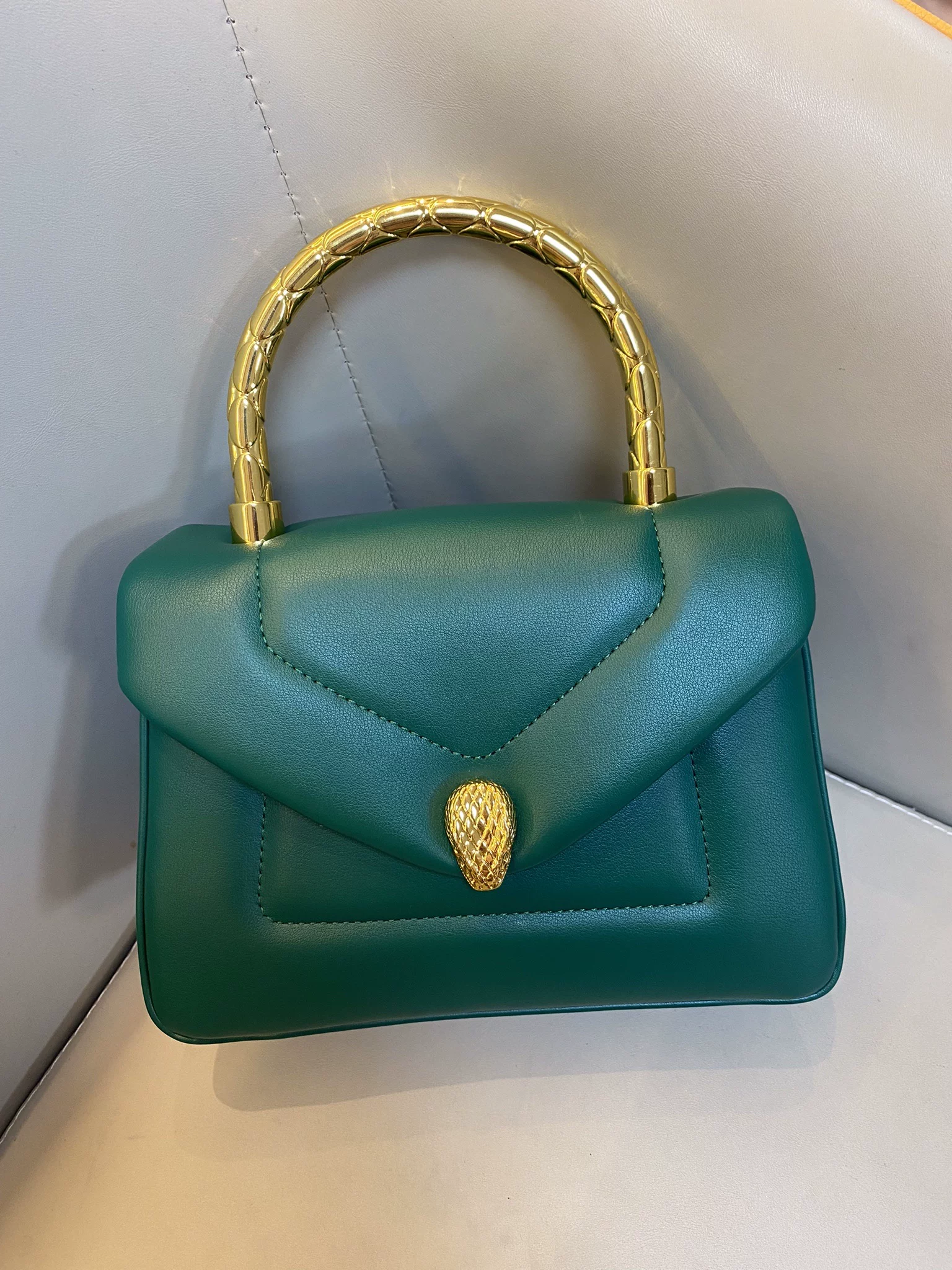 Women's Small Minimalist Leather Snake Head Clasp Top Handle Bag In Gold Hardware photo review